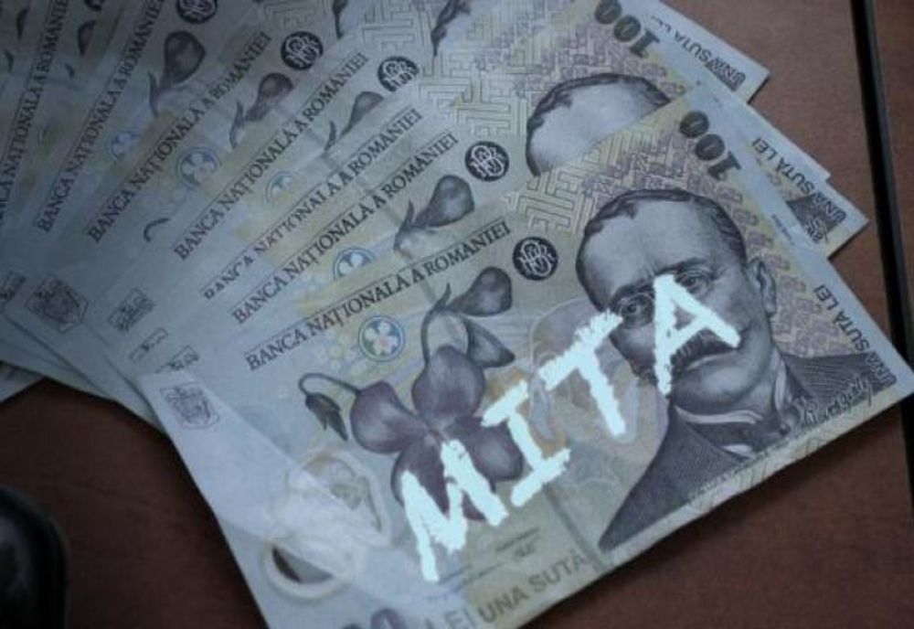 Flagrant! Bărbat prins în timp ce dădea mită unui polițist din Bolintin Vale