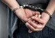 Două persoane, condamnate pentru luare de mită și cumpărare de influență, prinse de polițiști și duse în penitenciar 